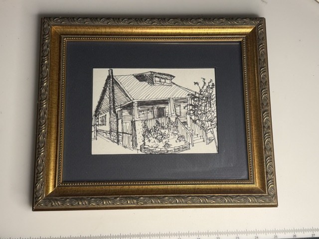 Framed ink portrait of a house with its porch and plantings